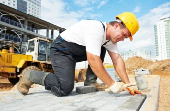 a construction worker labors on site.